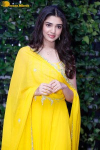 Actress Kirthi Shetty in a yellow salwar dress