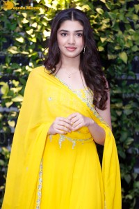 Actress Kirthi Shetty in a yellow salwar dress