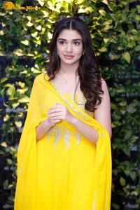 Actress Kirthi Shetty in a yellow salwar dress