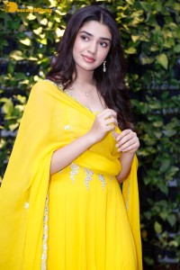 Actress Kirthi Shetty in a yellow salwar dress