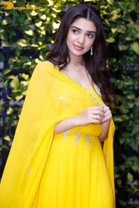 Actress Kirthi Shetty in a yellow salwar dress
