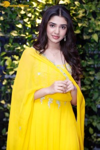 Actress Kirthi Shetty in a yellow salwar dress