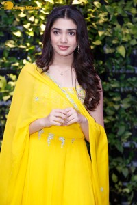 Actress Kirthi Shetty in a yellow salwar dress