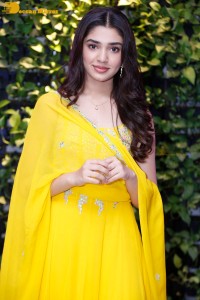 Actress Kirthi Shetty in a yellow salwar dress