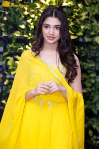 Actress Kirthi Shetty in a yellow salwar dress