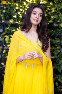 Actress Kirthi Shetty in a yellow salwar dress