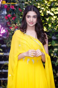 Actress Kirthi Shetty in a yellow salwar dress