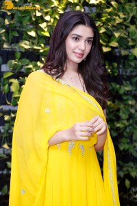Actress Kirthi Shetty in a yellow salwar dress