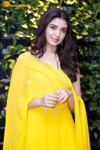 Actress Kirthi Shetty in a yellow salwar dress