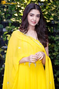Actress Kirthi Shetty in a yellow salwar dress