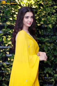 Actress Kirthi Shetty in a yellow salwar dress