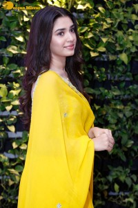 Actress Kirthi Shetty in a yellow salwar dress