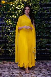 Actress Kirthi Shetty in a yellow salwar dress