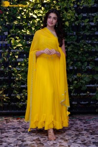 Actress Kirthi Shetty in a yellow salwar dress