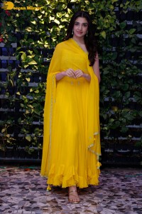 Actress Kirthi Shetty in a yellow salwar dress