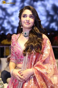 actress krithi shetty in a red lehenga choli dress