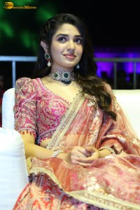 actress krithi shetty in a red lehenga choli dress