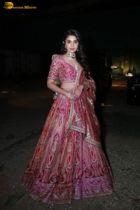 actress krithi shetty in a red lehenga choli dress