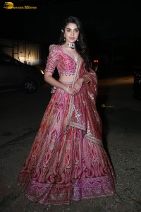 actress krithi shetty in a red lehenga choli dress