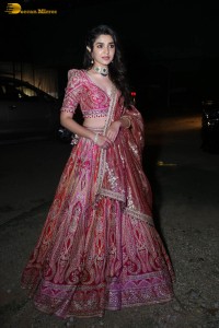 actress krithi shetty in a red lehenga choli dress