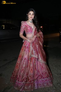 actress krithi shetty in a red lehenga choli dress