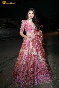 actress krithi shetty in a red lehenga choli dress