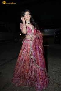 actress krithi shetty in a red lehenga choli dress