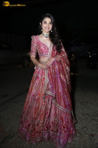actress krithi shetty in a red lehenga choli dress