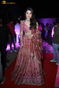 actress krithi shetty in a red lehenga choli dress