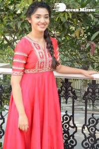 Actress Krithi Shetty in a red color salwar dress