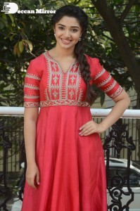 Actress Krithi Shetty in a red color salwar dress