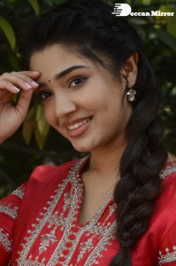 Actress Krithi Shetty in a red color salwar dress