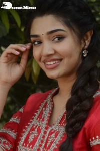 Actress Krithi Shetty in a red color salwar dress