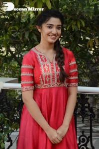 Actress Krithi Shetty in a red color salwar dress