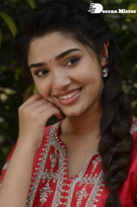 Actress Krithi Shetty in a red color salwar dress