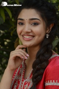 Actress Krithi Shetty in a red color salwar dress