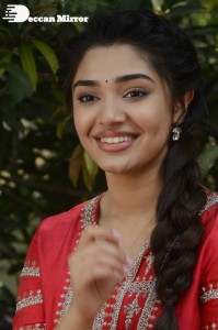 Actress Krithi Shetty in a red color salwar dress