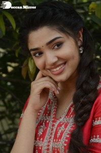 Actress Krithi Shetty in a red color salwar dress