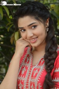 Actress Krithi Shetty in a red color salwar dress