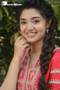 Actress Krithi Shetty in a red color salwar dress