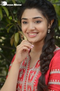 Actress Krithi Shetty in a red color salwar dress