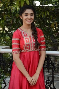 Actress Krithi Shetty in a red color salwar dress