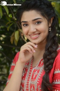 Actress Krithi Shetty in a red color salwar dress