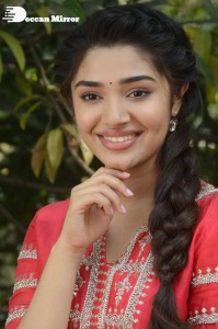 Actress Krithi Shetty in a red color salwar dress