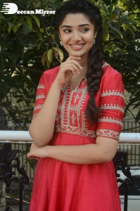 Actress Krithi Shetty in a red color salwar dress