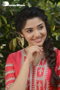 Actress Krithi Shetty in a red color salwar dress