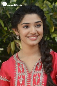 Actress Krithi Shetty in a red color salwar dress