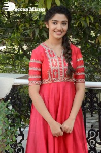 Actress Krithi Shetty in a red color salwar dress