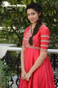 Actress Krithi Shetty in a red color salwar dress