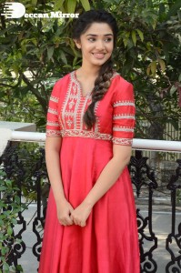 Actress Krithi Shetty in a red color salwar dress